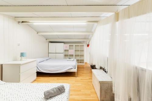 a room with two beds and a window at Arizona in Pozo de los Palos