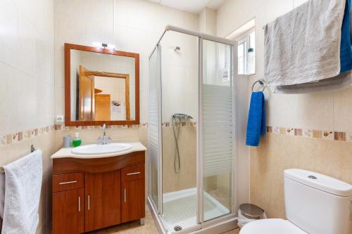 a bathroom with a shower and a sink and a toilet at Arizona in Pozo de los Palos