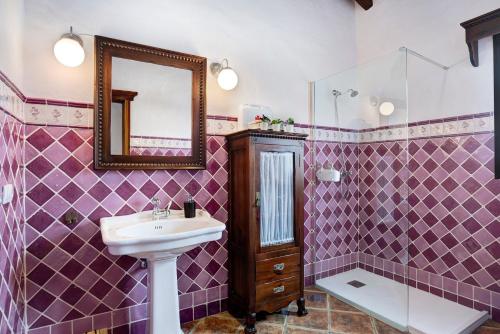 a bathroom with a sink and a mirror at Villa Elsa in Conil de la Frontera