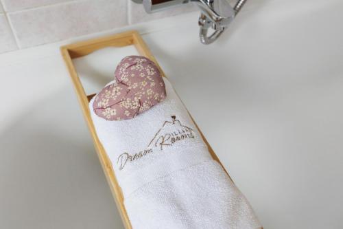 a valentines napkin and a heart cookie on a counter at Dream Room Apartment in Illasi