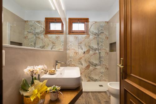 a bathroom with a sink and a toilet at Podere Sasso 3 in San Gimignano