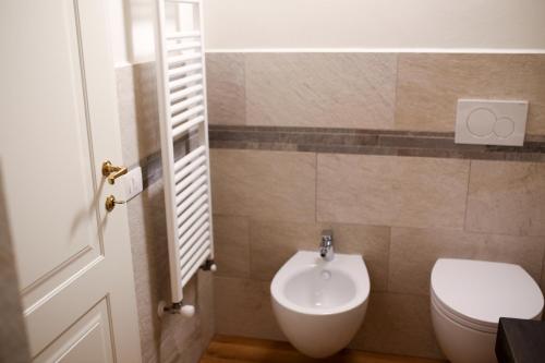 a bathroom with a toilet and a sink at Casanova in Scandicci
