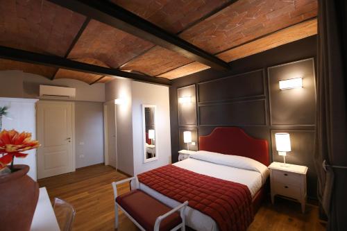 a bedroom with a bed and a table and a chair at Casanova in Scandicci