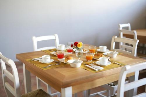 a wooden table with food and drinks on it at Casanova in Scandicci