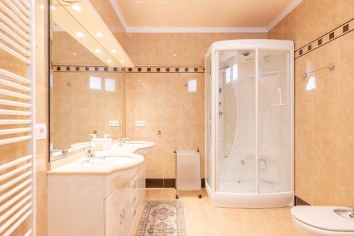 a bathroom with two sinks and a shower at Macondo Altea Hills in Altea
