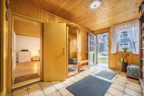 an open door in a room with wooden walls at Ferienhaus Bergmannsruh in Clausthal-Zellerfeld