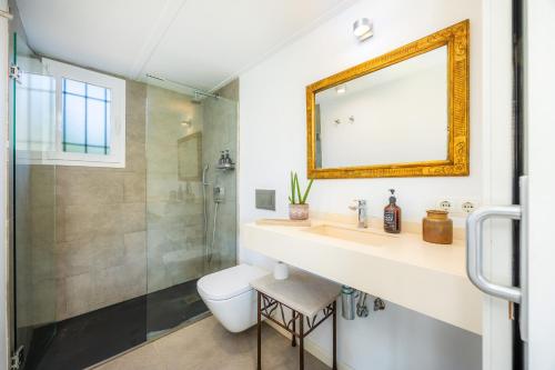 a bathroom with a sink and a shower at Les Herbetes in Port de Pollensa