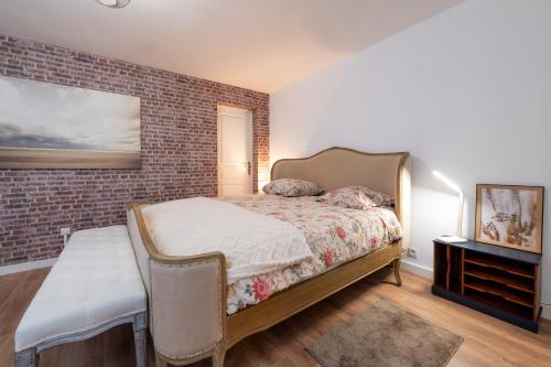 Llit o llits en una habitació de Petit appartement