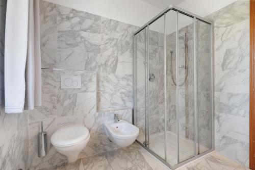 a bathroom with a shower and a toilet and a sink at Apartment Jose in Tremosine Sul Garda