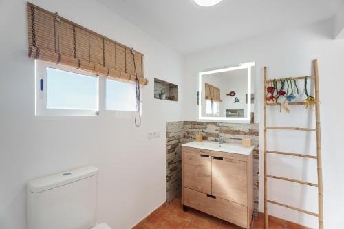 a bathroom with a sink and a ladder at Espacio vivo Pisaverde in Tacoronte