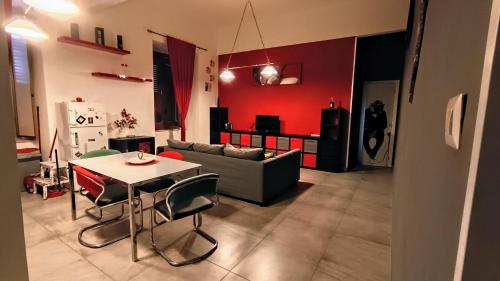 a living room with a table and a couch at Casa baja in Bacoli