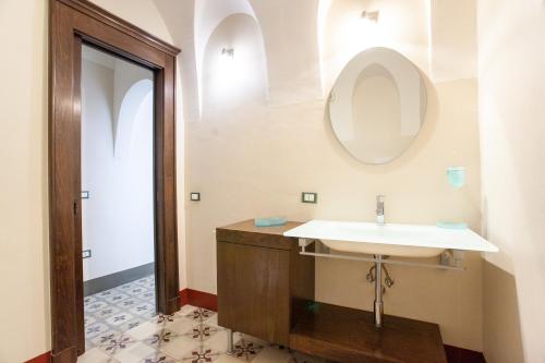 a bathroom with a sink and a mirror at Hora Vona in Orosei