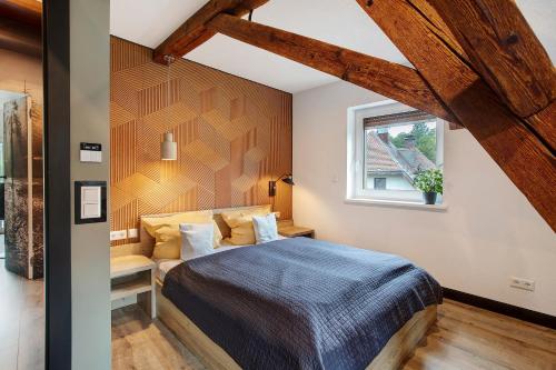 a bedroom with a bed and a window at Heimelige Schwarzwaldwohnung Wald in Häusern