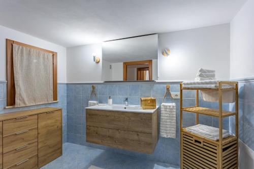 a bathroom with a sink and a mirror at Casa Altoliva in Marsala