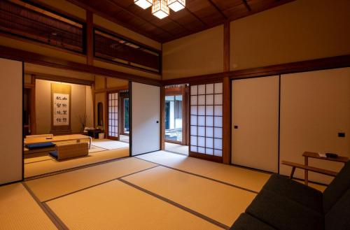 a japanese room with a living room with at Mifuneyama Rakuen Hotel in Takeo