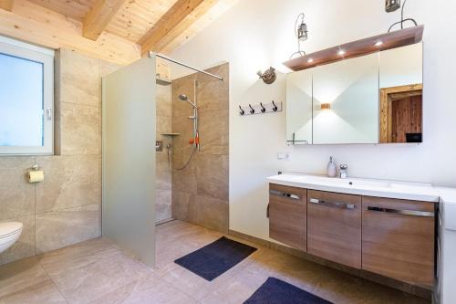 a bathroom with a shower and a sink at Ferienwohnung Petra Top 3 in Kössen
