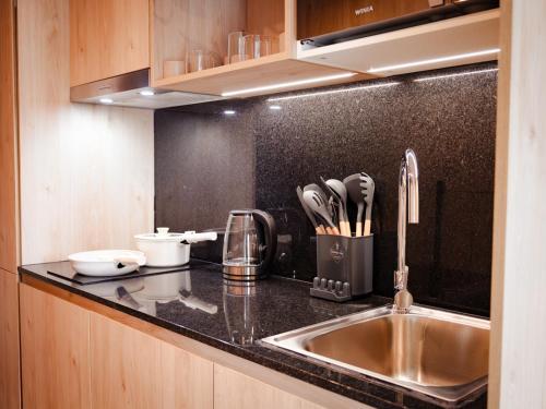 a kitchen with a sink and a counter top at Mutuo Vive in Guadalajara