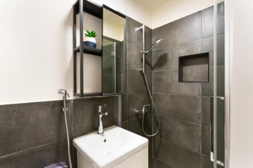 a bathroom with a sink and a shower at Charro Room in Corralejo