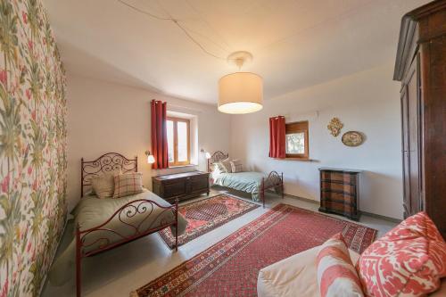a living room with a couch and a fireplace at Villa Cristina in Riparbella