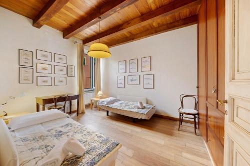 a bedroom with a bed and a table in a room at Chéz Dede in Levanto