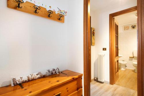 a bathroom with a wooden counter and a toilet at Maison Sylvie Pila in Gressan