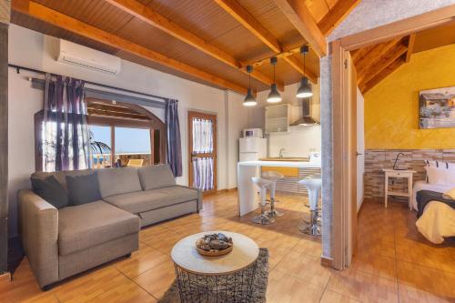 a living room with a couch and a table at Chabela's Penthouse in Lajita