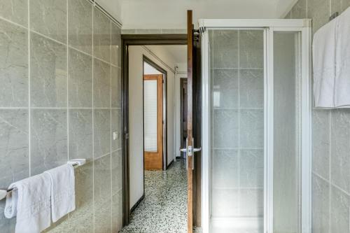 a bathroom with a shower and a glass door at Can Picola in Capmany