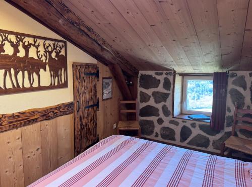 a bedroom with a giraffe themed bed in a cabin at Le Mont De La Source in Lafarre