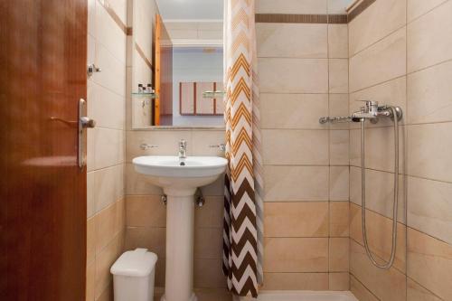 a bathroom with a sink and a toilet and a shower at Zante View Family Studio 1 in Tsilivi