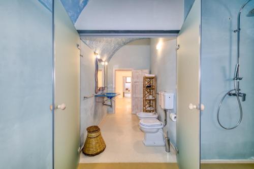 a bathroom with two toilets and a shower at Masseria Scafazzi - Salento in Presicce