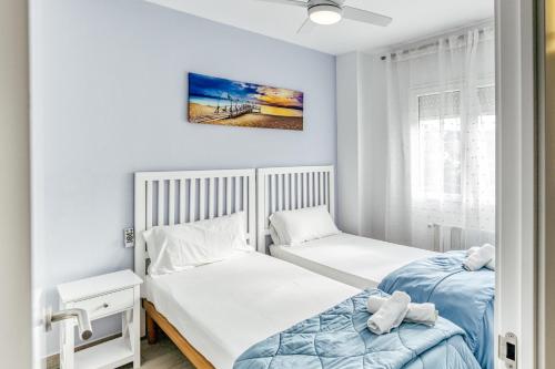 a bedroom with two beds and a window at Casa en Begur reformada in Begur