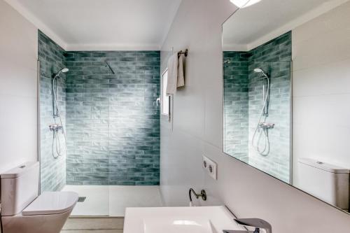 a bathroom with a sink and a shower at Casa en Begur reformada in Begur