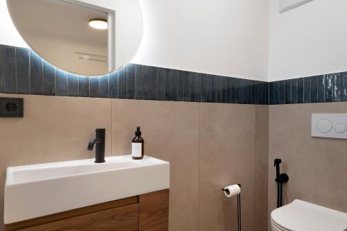 a bathroom with a sink and a mirror at Apartment Anna in Soprabolzano