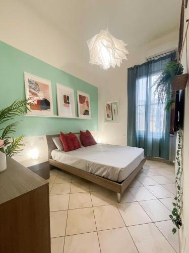 a bedroom with a bed in a room with a window at Piave House - Pisa in Pisa