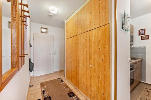 a hallway with a sliding door in a house at Ferienwohnung 'Segelyachten-Perle' in Schilksee