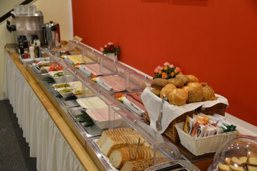 a buffet line with many different types of food at Hotel Italia in Munich