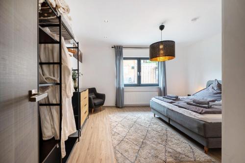 a bedroom with a bed and a window at Eifel-resort in Waxweiler