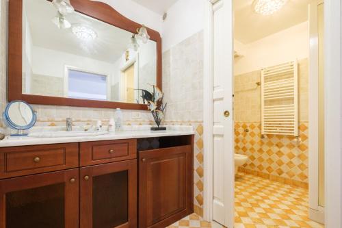 a bathroom with a sink and a mirror at Casa della Poiana in Lipari