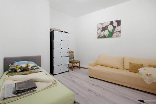 a living room with a couch and a dresser at an der Mosel in Kaisersesch