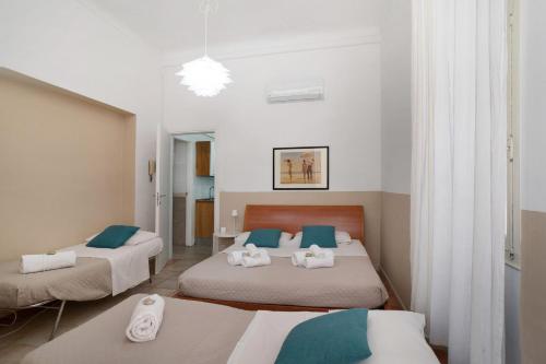 a bedroom with two beds with blue and white at Holiday sea 1 in Diano Marina