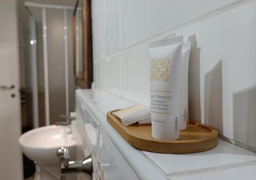 a bathroom with a bottle of sunscreen on a counter at Holiday sea 1 in Diano Marina