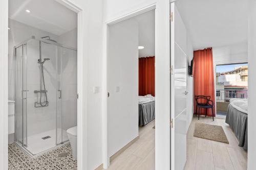 a bathroom with a shower and a toilet at 100 Beach Seaview in Torrevieja