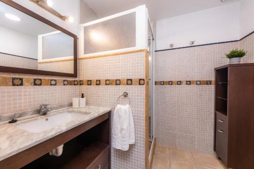 a bathroom with a sink and a shower at Sa Mina in Santa Margalida