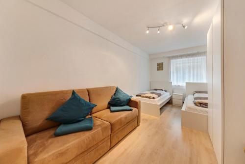 a living room with a couch and a bed at Apartment Bergkristall in Nova Levante