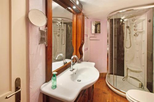 a bathroom with a sink and a shower at Casa Al Molo in Musso