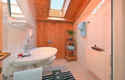 a bathroom with a white sink and a shower at Fillerhof in Villnoss