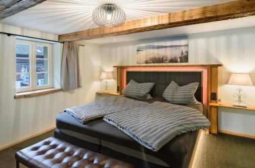 a bedroom with a large bed and a window at Altes Höhlenführerhaus in Rübeland