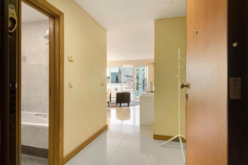 a hallway with a door leading to a living room at Dfm Happy Days A - Funchal in Funchal