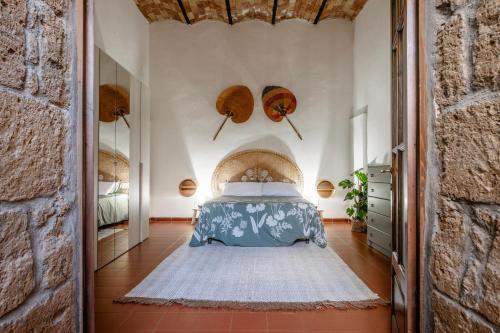 a bedroom with a bed in a room at Loft Orsini - Pitigliano in Pitigliano