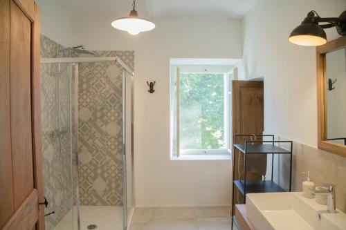 a bathroom with a shower and a sink at Cascina Voglietti - Private Pool in Murisengo